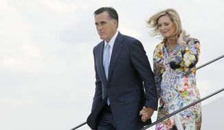 ** FILE ** Mitt Romney, the presumptive Republican nominee, and his wife, Ann, arrive in Gdansk, Poland, on Monday, July 30, 2012. (Associated Press)