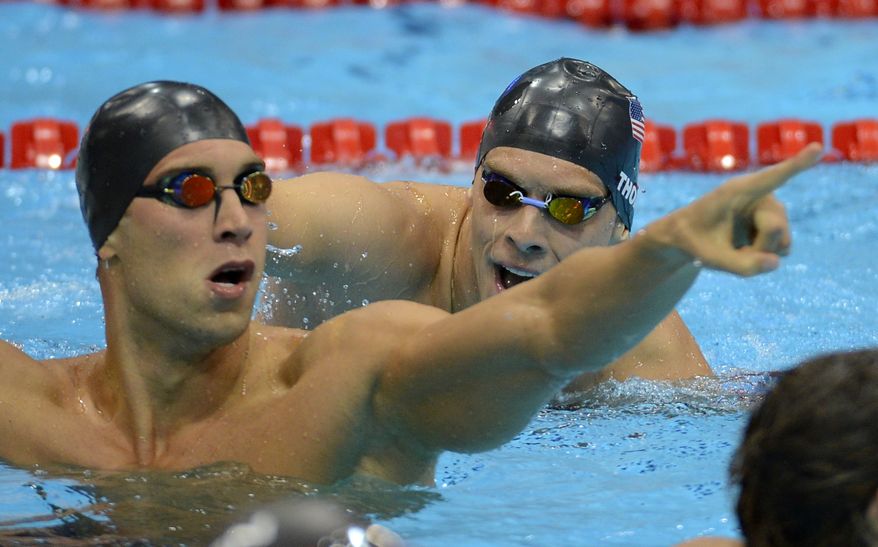 United States' Matthew Grevers, left, and United States' Nick Thoman react after the men's 100-meter backstroke swimming final at the Aquatics Centre in the Olympic Park during the 2012 Summer Olympics in London, Monday, July 30, 2012. Grevers won gold, Thoman silver. (AP Photo/David J. Phillip)