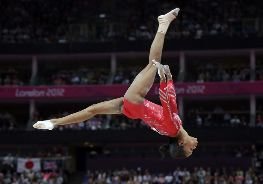 U.S. gymnast Gabrielle Douglas performs July 31, 2012, on the balance beam during the artistic gymnastics women's team final at the 2012 Summer Olympics in London. (Associated Press)