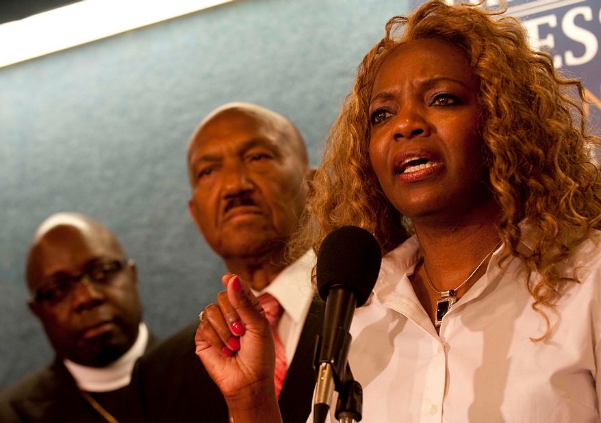 Presiding Prelate of the Covenant International Fellowship of Churches Bishop Janice Hollis, from Philadelphia, Pa., joins Wiliam Owen, president and founder of the Coalition of African-American Pastors, to launch a national campaign to oppose President Obama's support of gay marriage during a press conference at the National Press Club on Tuesday, July 31, 2012, in Washington D.C. "He does not have a pass," Hollis says in response to the general belief that President Obama is going to win the majority of the African American vote. The CAAP say they are urging black pastors around the country to oppose the president's actions and withdraw support for him in the upcoming November elections. (Raymond Thompson/The Washington Times)