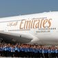 Workers of Airbus accompany the first Airbus A380 plane for the Emirates airline during a ceremony at the German Airbus plant in Hamburg Finkenwerder in June 2008. The Gulf’s three big airlines are all increasingly forging cross-border partnerships to extend their reach deeper into international markets. (Associated Press)