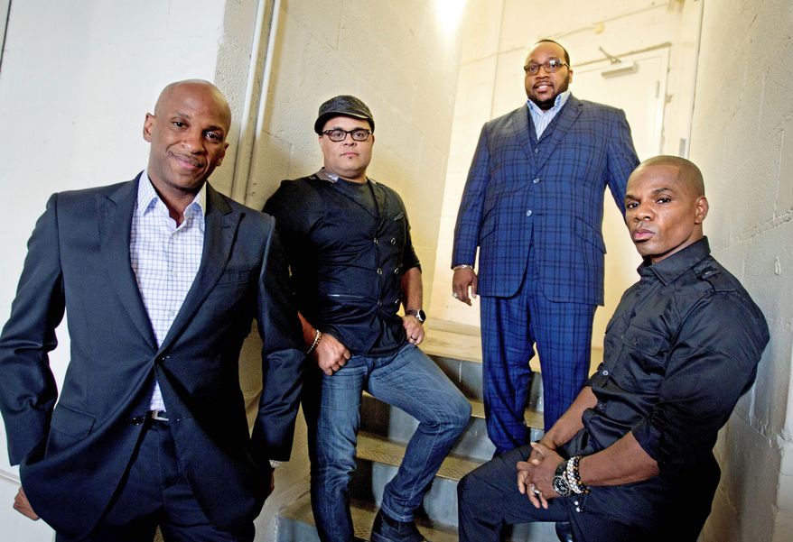 Singer Donnie McClurkin (far left) with gospel group the King's Men. (Associated Press)