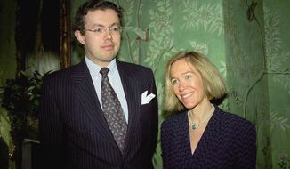 **FILE** Eva Rausing (right) and husband Hans Kristian Rausing attend Nov. 26, 1996, the Glamour America Fashion Show and lunch at Winfield House, London, the residence of the U.S. ambassador to the U.K. (Associated Press/Alan Davidson/The Picture Library Ltd)