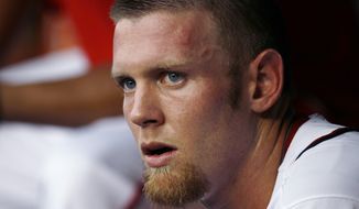 Washington Nationals starting pitcher Stephen Strasburg sits in the dugout in the first inning of a a baseball game against the Philadelphia Phillies, Tuesday, July 31, 2012, in Washington. The Phillies won 8-0. (AP Photo/Carolyn Kaster)