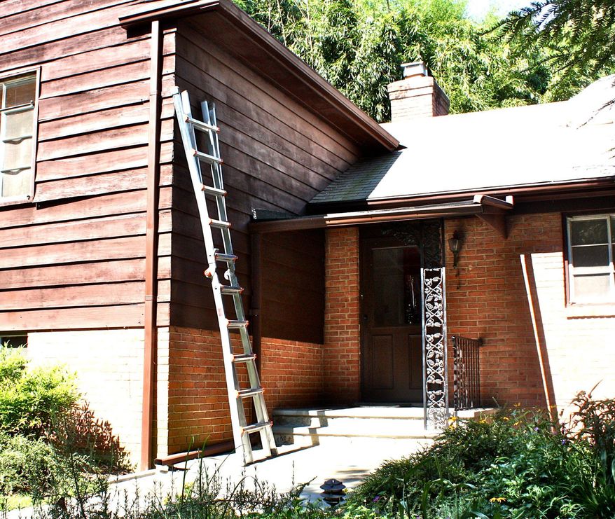 Architect David Benton removed the metal trellis detail when revamping the entry to his split-level home. He also added a new portico entrance.