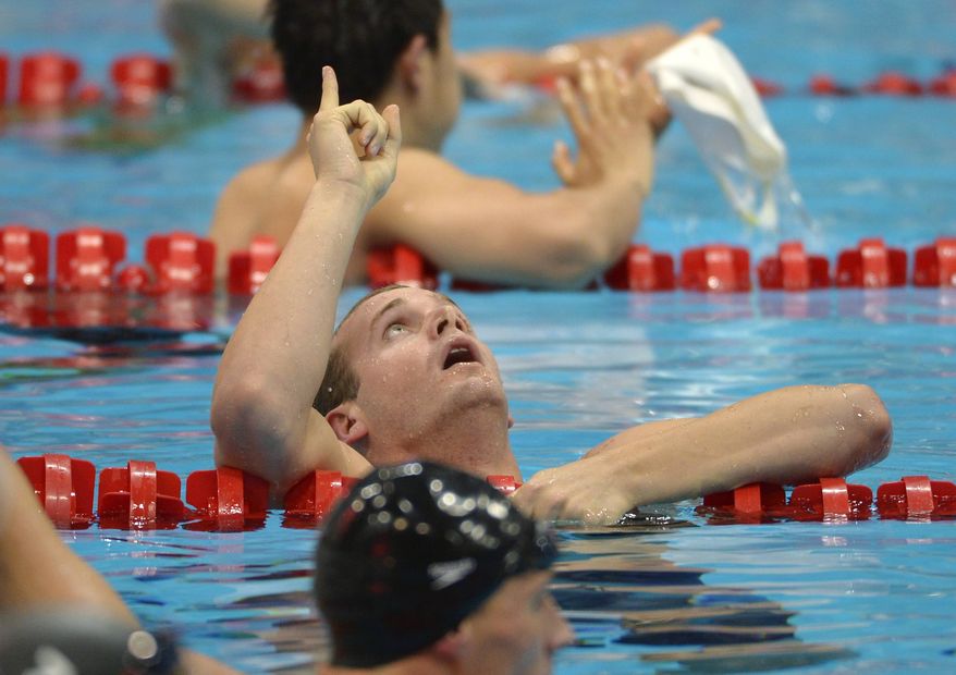 United States' Tyler Clary celebrates winning gold in the men's 200-meter backstroke swimming final at the Aquatics Centre in the Olympic Park during the 2012 Summer Olympics in London, Thursday, Aug. 2, 2012. (AP Photo/Mark J. Terrill)