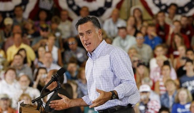 ** FILE ** Republican presidential candidate, former Massachusetts Gov. Mitt Romney campaigns at the Jefferson County Fairgrounds in Golden, Colo., Thursday, Aug. 2, 2012. (AP Photo/Charles Dharapak)