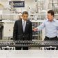 **FILE** President Obama, accompanied by Solyndra CEO Chris Gronet, looks at a solar panel during a May 26, 2010, tour of Solyndra Inc., a solar panel manufacturing facility, in Fremont, Calif. (Associated Press)