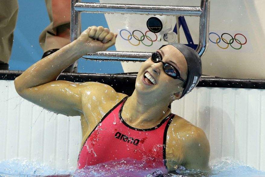 United States' Rebecca Soni celebrates her gold medal finish in the women's 200-meter breaststroke swimming final at the Aquatics Centre in the Olympic Park during the 2012 Summer Olympics in London, Thursday, Aug. 2, 2012. (AP Photo/Matt Slocum)