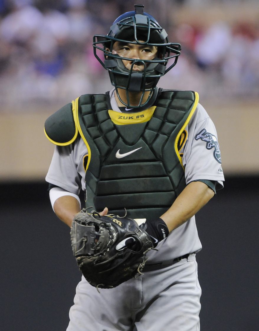 The Washington Nationals traded for Oakland A's catcher Kurt Suzuki on Friday afternoon, adding a veteran piece to their catching corps. (AP Photo/Jim Mone)