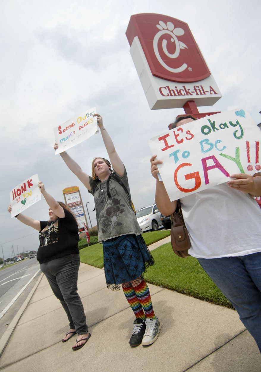 Gay marriage supporters, from left, Emmie Hesley, Cathy Dear and Amy Paffenroth hold signs in front of a Chick-fil-A in Fort Walton Beach, Fla., Thursday Aug. 2, 2012, in protest of the chicken eatery's stance on gay marriage. (AP Photo/Northwest Florida Daily News, Nick Tomecek) **FILE**