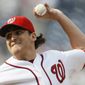 Washington Nationals starting pitcher John Lannan delivers in the first inning during the first baseball game of a doubleheader against the Miami Marlins, Friday, Aug. 3, 2012, in Washington. (AP Photo/Carolyn Kaster)