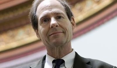 ** FILE ** In this file photo taken on March 16, 2011, Cass Sunstein, director of the Office of Information and Regulatory Affairs at the Office of Management and Budget, poses for a photo at the Eisenhower Executive Office Building across from the White House in Washington. (AP Photo)
