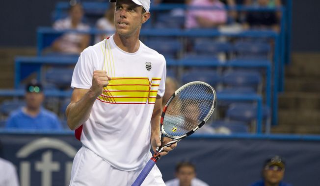 Sam Querrey reacts after defeating Kevin Anderson, of South Africa, during the Citi Open tennis tournament on Friday, Aug. 3, 2012, in Washington. (AP Photo/Evan Vucci)
