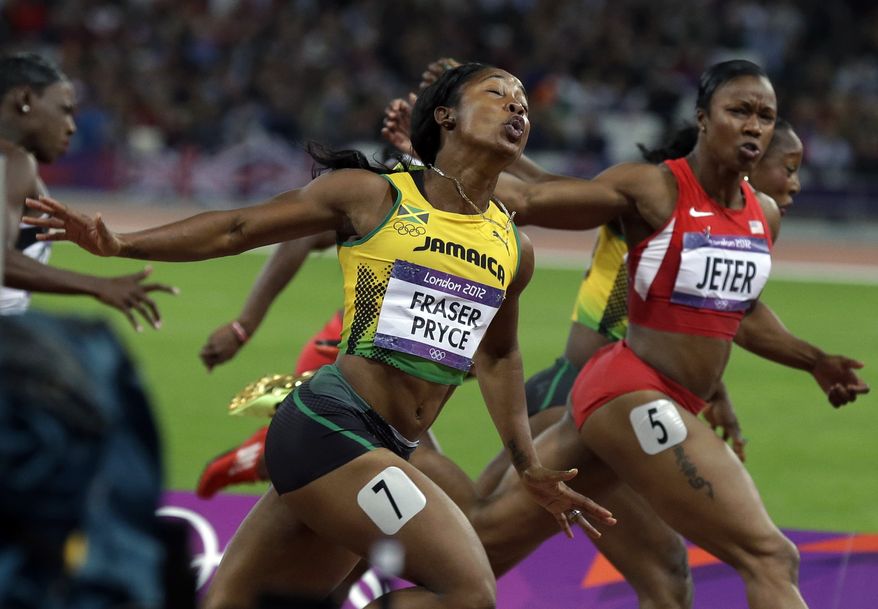 Gold medal winner, Jamaica's Shelly-Ann Fraser-Pryce, left, crosses the finish line ahead of silver medal winner United States' Carmelita Jeter during the women's 100-meter final during athletics competition in the Olympic Stadium at the 2012 Summer Olympics, Saturday, Aug. 4, 2012, in London. (AP Photo/Rebecca Blackwell)