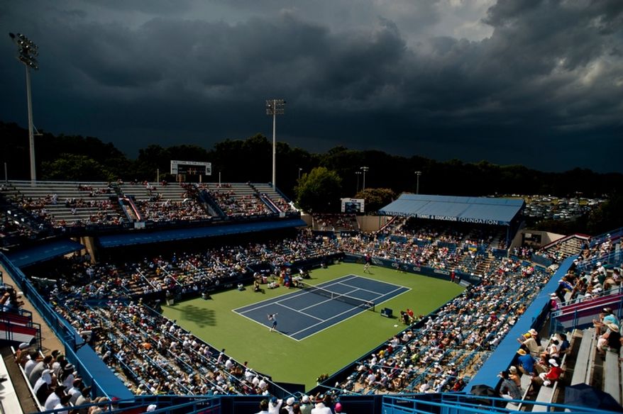 Storm clouds roll in during the men's finals match between Tommy Haas and Alexandr Dolgopolov at the Citi Open tennis tournament at the William H.G. FitzGerald Tennis Center, Washington D.C., Sunday, August 5, 2012. The match has been delayed several times due to rain. (Ryan M.L. Young/The Washington Times)