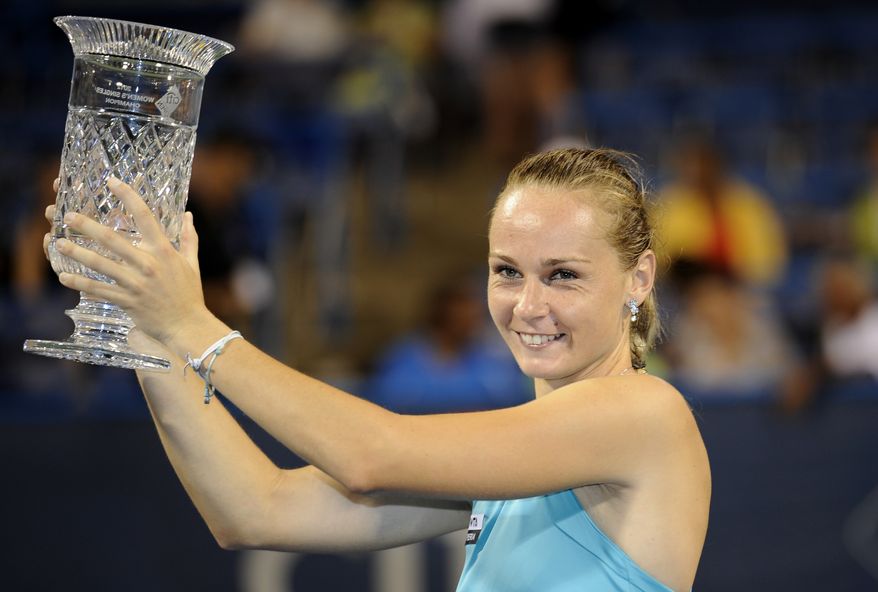 Magdalena Rybarikova, of Slovakia, poses with the trophy after she won the women's final in the Citi Open tennis tournament against Anastasia Pavlyuchenkova, of Russia, against , Saturday, Aug. 4, 2012, in Washington. Rybarikova won 6-1, 6-1. (AP Photo/Nick Wass)