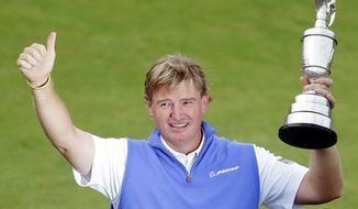 associated press
Ernie Els, of South Africa, holds up the Claret Jug after winning the British Open Golf Championship at Royal Lytham &amp; St. Annes golf club, in Lytham St. Annes, England, July 22. Els now has his sights on the PGA Championship in South Carolina.