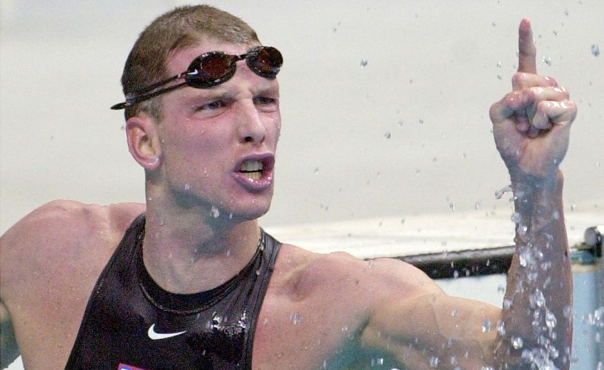 Tom Dolan celebrates his gold-medal win in the 400 IM at the Sydney Summer Olympics in 2000. He also set a world record in the event in 1996 that lasted for nine years. (Associated Press)