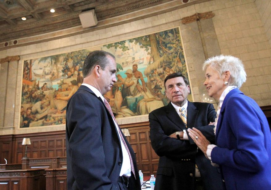 Republicans used an empty courthouse in Miami to make a point about a long list of vacant or underused federal property. Shown are Rep. Mario Diaz-Balart, Rep. John L. Mica and U.S. Circuit Judge Frank M. Hull (from left). (Associated Press)