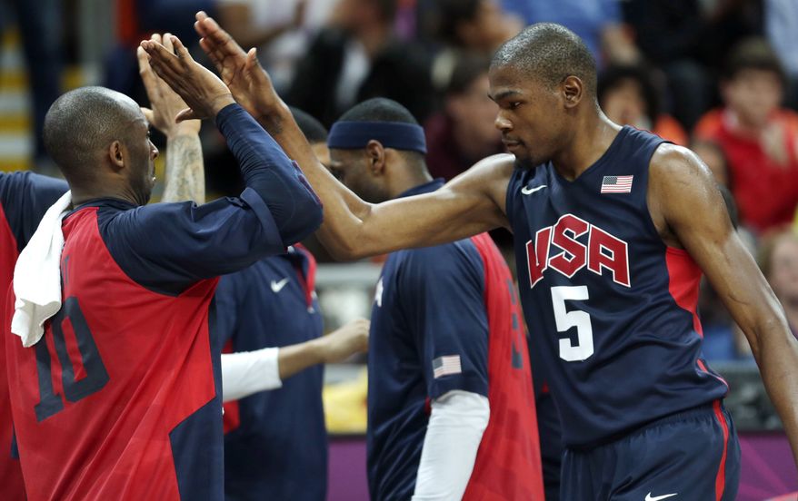 Kevin Durant, right, is back on the U.S. Olympic team. (AP Photo/Charles Krupa)