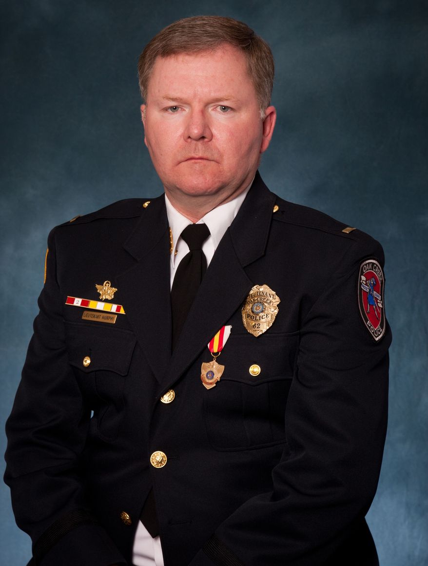 This undated picture provided by the Oak Creek Police Department shows Lt. Brian Murphy. Murphy, 51, is a 21-year veteran with the Oak Creek Police Department. Police Chief John Edwards said the gunman in the Sikh temple shooting "ambushed" Murphy, one of the first officers to arrive at the temple as the officer tended to a victim outside, shooting him eight to nine times with a handgun at close range. (AP Photo/Oak Creek Police Department)