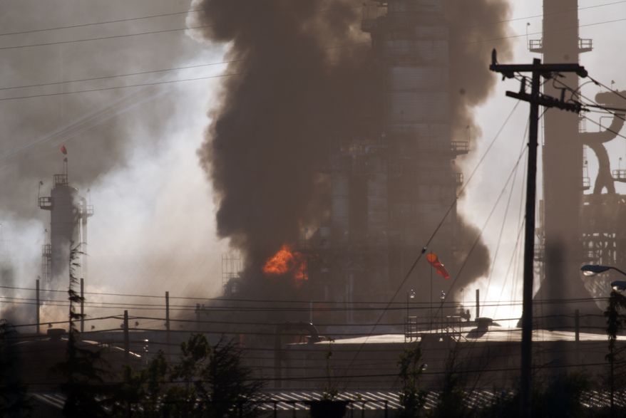 Smoke and flame billow from a crude oil unit Aug. 6, 2012, at the Chevron refinery in Richmond, Calif. The facility makes high-quality products that include gasoline, jet fuel, diesel fuel and lubricants, as well as chemicals used to manufacture many other useful products. (Associated Press/The Contra Costa Times, D. Ross Cameron)