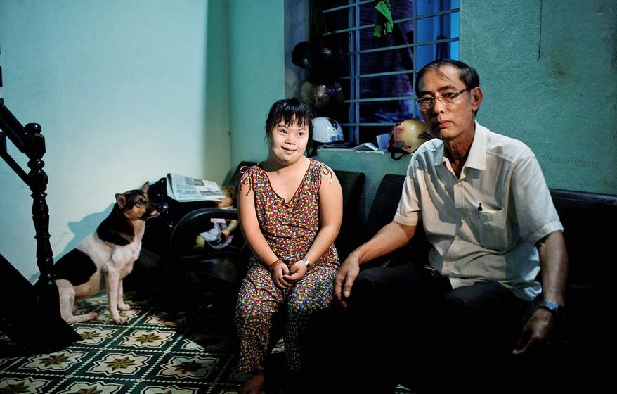 Vo Duoc and his niece Vo Thi Thuy Nga, 24, live in Danang, site of a U.S. base during the Vietnam War. She was born with physical and mental disabilities, and Mr. Duoc and other members of his family are ailing. Blood tests confirm that they have elevated levels of dioxin, the chemical used in Agent Orange. (Associated Press)