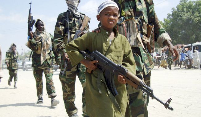 In early 2010, a boy led the hard-line Islamist al-Shabab fighters as they conducted military exercise in Somalia. The country’s continuous violence appears to have increased recruiting efforts of young fighters, who are easily indoctrinated. (Associated Press)