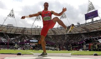 United States&#x27; Ashton Eaton reacts Aug. 8, 2012, after his throw in the shot put during the decathlon at the Olympic Stadium in London. (Associated Press)