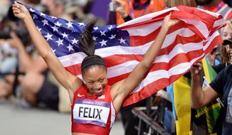 United States&#39;  Allyson Felix celebrates her win in the women&#39;s 200-meter final during the athletics in the Olympic Stadium at the 2012 Summer Olympics, London, Wednesday, Aug. 8, 2012. (AP Photo/Martin Meissner)