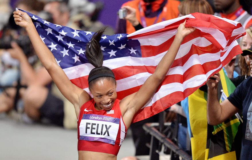 United States' Allyson Felix celebrates her win in the women's 200-meter final during the athletics in the Olympic Stadium at the 2012 Summer Olympics, London, Wednesday, Aug. 8, 2012. (AP Photo/Martin Meissner)