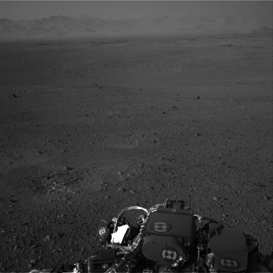 This image released by NASA on Wednesday, Aug. 8, 2012, and taken by cameras aboard the Curiosity rover shows the Martian horizon. (AP Photo/NASA)