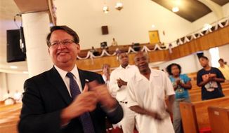 Democratic U.S. Rep. Gary Peters, left, campaigns for Michigan&#39;s new 14th district congressional seat at St. Paul A.M.E. Church in Detroit. (AP Photo/Detroit Free Press, Susan Tusa)