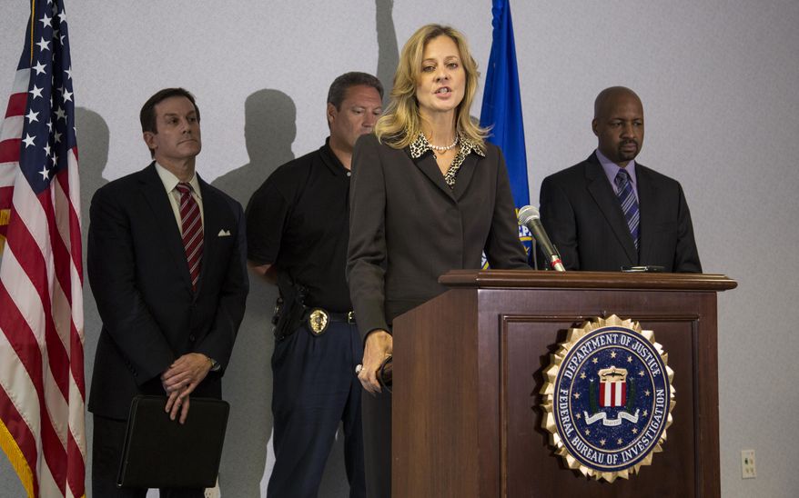 Teresa Carlson, FBI special agent in charge in Milwaukee, speaks at a press briefing in Milwaukee on Wednesday, Aug. 8, 2012, about the mass shooting at the Sikh Temple of Wisconsin on Sunday. (AP Photo/Tom Lynn)