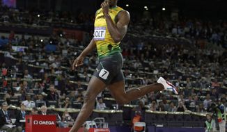 Jamaica&#39;s Usain Bolt gestures as he crosses the finish line to win gold in the men&#39;s 200-meter final during the athletics in the Olympic Stadium at the 2012 Summer Olympics, London, Thursday, Aug. 9, 2012. (AP Photo/David J. Phillip)