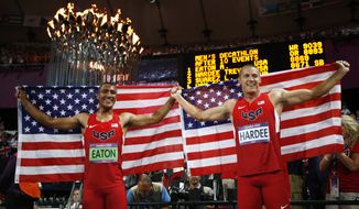 Gold medallist Ashton Eaton of the United States, left, and silver medallist Trey Hardee of the United States celebrate following the decathlon 1500-meter during the athletics in the Olympic Stadium at the 2012 Summer Olympics, London, Thursday, Aug. 9, 2012. (AP Photo/Matt Dunham)