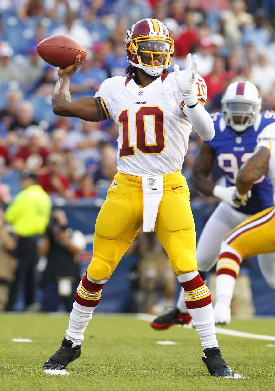 Washington Redskins quarterback Robert Griffin III throws during the first half of a preseason NFL football game against the Buffalo Bills in Orchard Park, N.Y., Thursday, Aug. 9, 2012. (AP Photo/Bill Wippert)
