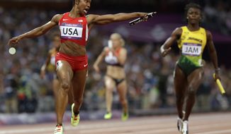 United States&#39; Carmelita Jeter reacts as she crosses the finish line to win the women&#39;s 4x100-meter relay at the 2012 Summer Olympics, London, Friday, Aug. 10, 2012. The United States relay team set a new world record with a time of 40.82 seconds. (AP Photo/Anja Niedringhaus)


