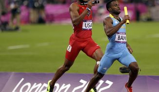 Bahamas&#39;s Ramon Miller leads USA&#39;s Angelo Taylor during the final leg of the men&#39;s 4x400-meter during the athletics in the Olympic Stadium at the 2012 Summer Olympics, London, Friday, Aug. 10, 2012. (AP Photo/Matt Slocum)