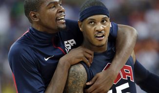 United States&#39; Kevin Durant, left, celebrates with teammate Carmelo Anthony (15) after he scored during a semifinal men&#39;s basketball game against Argentina at the 2012 Summer Olympics, Friday, Aug. 10, 2012, in London. (AP Photo/Eric Gay)