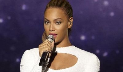 In this photo provided by Parkwood Entertainment, singer Beyonce performs “I Was Here” in the United Nations General Assembly Hall, Friday, Aug. 10, 2012. Beyonce performed in front of hundreds, including Julia Stiles, R&B singer The-Dream and songwriter Diane Warren, who wrote “I Was Here.” (AP Photo/Parkwood Entertainment, Cliff Watts)