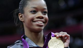 FILE- In this Thursday, Aug. 2, 2012, file photo, U.S. gymnast Gabrielle Douglas displays her gold medal during the artistic gymnastics women&#39;s individual all-around competition at the 2012 Summer Olympics, in London. With the gymnastics competition over, the U.S. women&#39;s gymnastics team is beginning to realize just how big a deal they&#39;ve become back home. (AP Photo/Julie Jacobson)