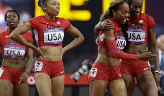 United States&#39; women&#39;s 4 X400-meter relay team from left, Francena McCorory, Allyson Felix, Sanya Richards-Ross and Deedee Trotter celebrate after winning the gold medal during the athletics in the Olympic Stadium at the 2012 Summer Olympics, London, Saturday, Aug. 11, 2012. (AP Photo/Anja Niedringhaus)