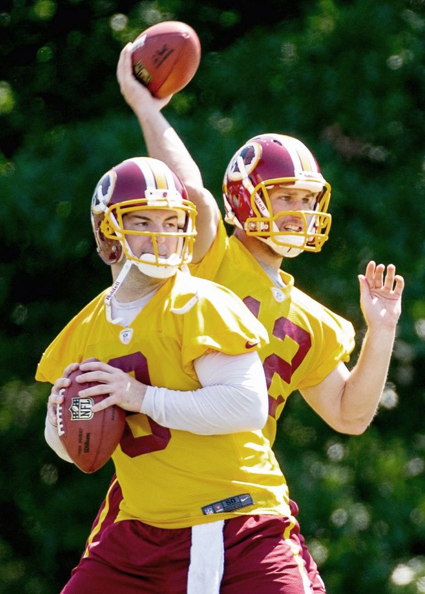 Andrew Harnik/The Washington Times
Redskins quarterbacks Rex Grossman (front) and Kirk Cousins are tasked with staying sharp as backups to rookie Robert Griffin III.