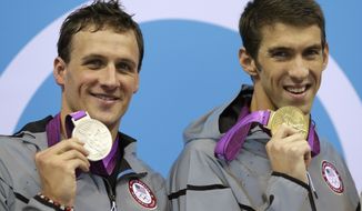 United States&#39; Michael Phelps, right, and United States&#39; Ryan Lochte pose with their medals for the men&#39;s 200-meter individual medley swimming final at the Aquatics Centre in the Olympic Park during the 2012 Summer Olympics in London, Thursday, Aug. 2, 2012. Phelps won gold and Lochte silver. (AP Photo/Michael Sohn)