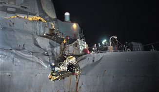 The USS Porter, a U.S. Navy guided-missile destroyer, was damaged in a collision with a Japanese-owned oil tanker just outside the strategic Strait of Hormuz on Sunday, Aug. 12, 2012. The collision left a gaping hole in the starboard side of the Porter, but no one was injured on either vessel, the Navy said. (AP Photo/U.S. Navy, Jonathan Sunderman)