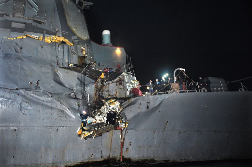 The USS Porter, a U.S. Navy guided-missile destroyer, was damaged in a collision with a Japanese-owned oil tanker just outside the strategic Strait of Hormuz on Sunday, Aug. 12, 2012. The collision left a gaping hole in the starboard side of the Porter, but no one was injured on either vessel, the Navy said. (AP Photo/U.S. Navy, Jonathan Sunderman)