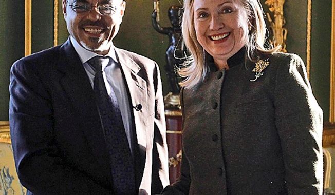 **FILE** U.S. Secretary of State Hillary Rodham Clinton meets Feb. 23, 2012, with Ethiopia&#x27;s Prime Minister Meles Zenawi at the London Conference on Somalia. (Associated Press)
