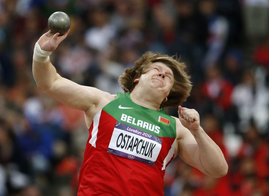 Nadzeya Ostapchuk of Belarus takes a throw in the women's shot put final at the Olympic Stadium at the 2012 Summer Olympics in London on Monday, Aug. 6, 2012. Ostapchuk became the first athlete to be stripped of a medal at the games after her gold was withdrawn for doping. (AP Photo/Matt Dunham)
